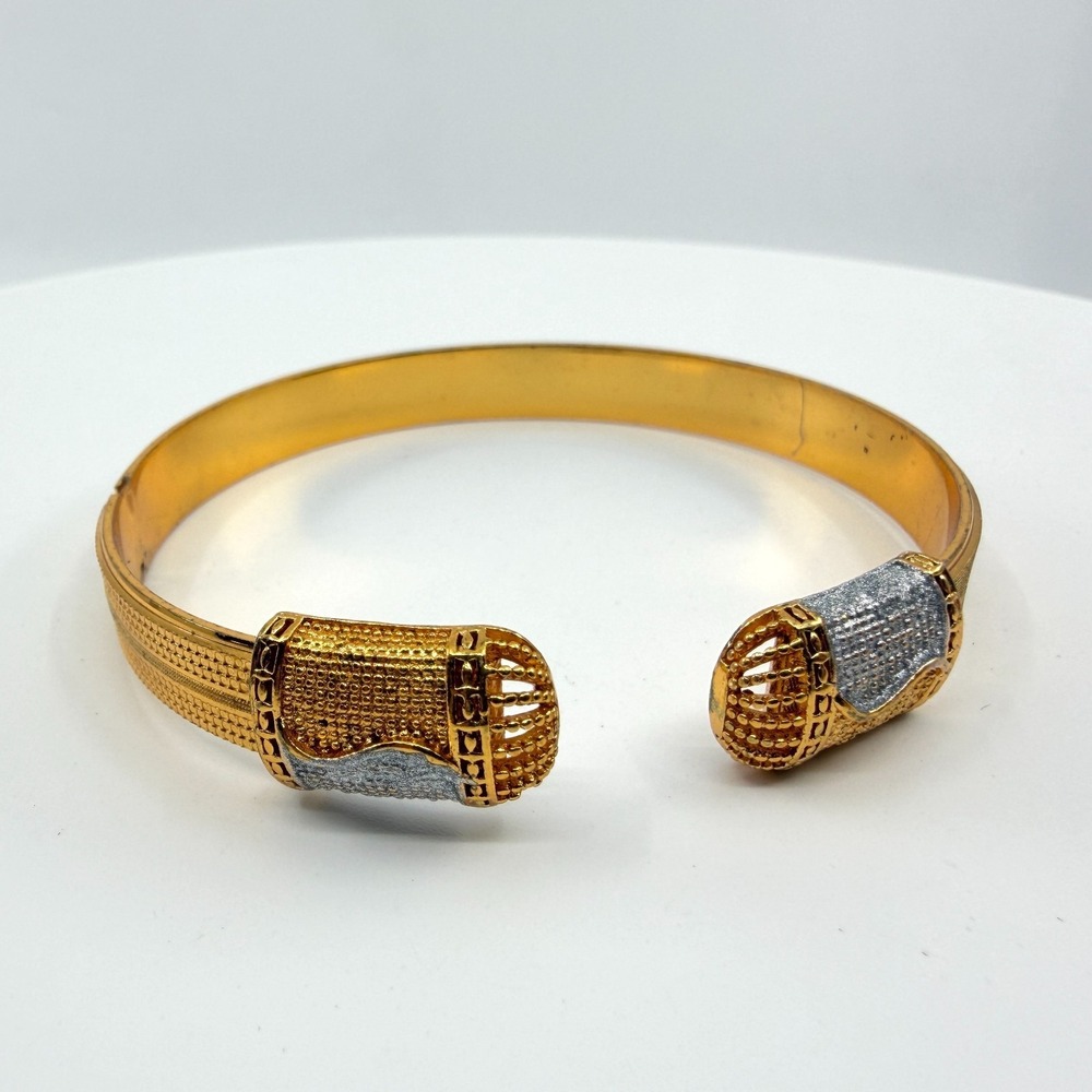 Elegant Gold Tone Cuff Bracelet with Textured Band & Two-Tone Accent